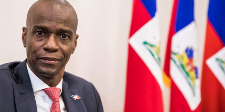(FILES) In this file photo taken on October 22, 2019 President Jovenel Moise sits at the Presidential Palace during an interview with AFP in Port-au-Prince, October 22, 2019. - Haitian President Jovenel Moise was assassinated on July 7, 2021, at his home by a commando, interim Prime Minister Claude Joseph announced. Joseph said he was now in charge of the country. (Photo by Valerie Baeriswyl / AFP)